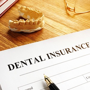 Dental insurance form on wooden desk